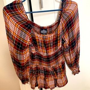 Plaid patterned soft peasant style top.